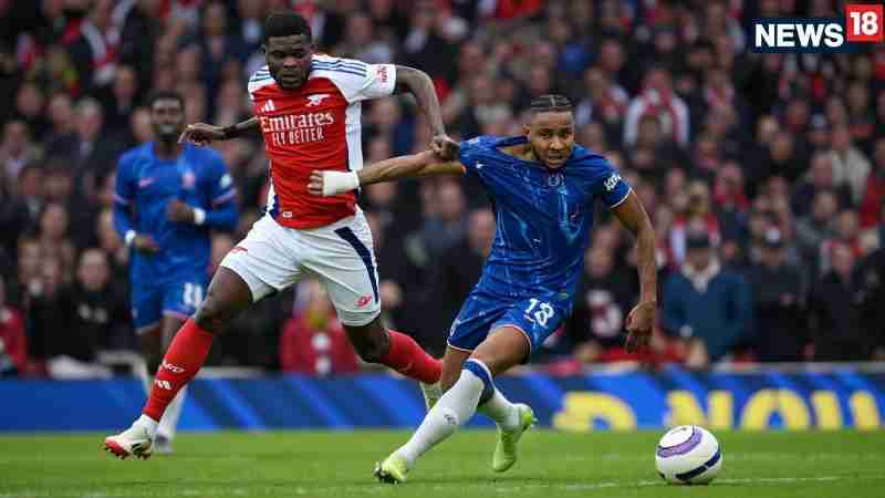 Chelsea face Arsenal in a high-voltage Carabao Cup semi-final clash, with both London rivals battling for a place in the final. The match is being closely watched as two Premier League giants go head- - Digital concept art for illustrative purpose - Monok